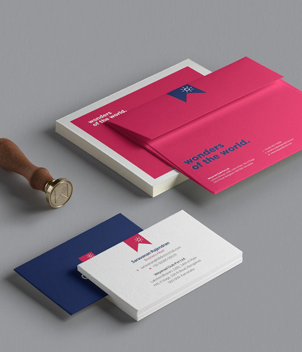 Club W travel brand stationery design including branded envelopes, business cards, and letterheads in pink and navy for premium family holidays in India and abroad.