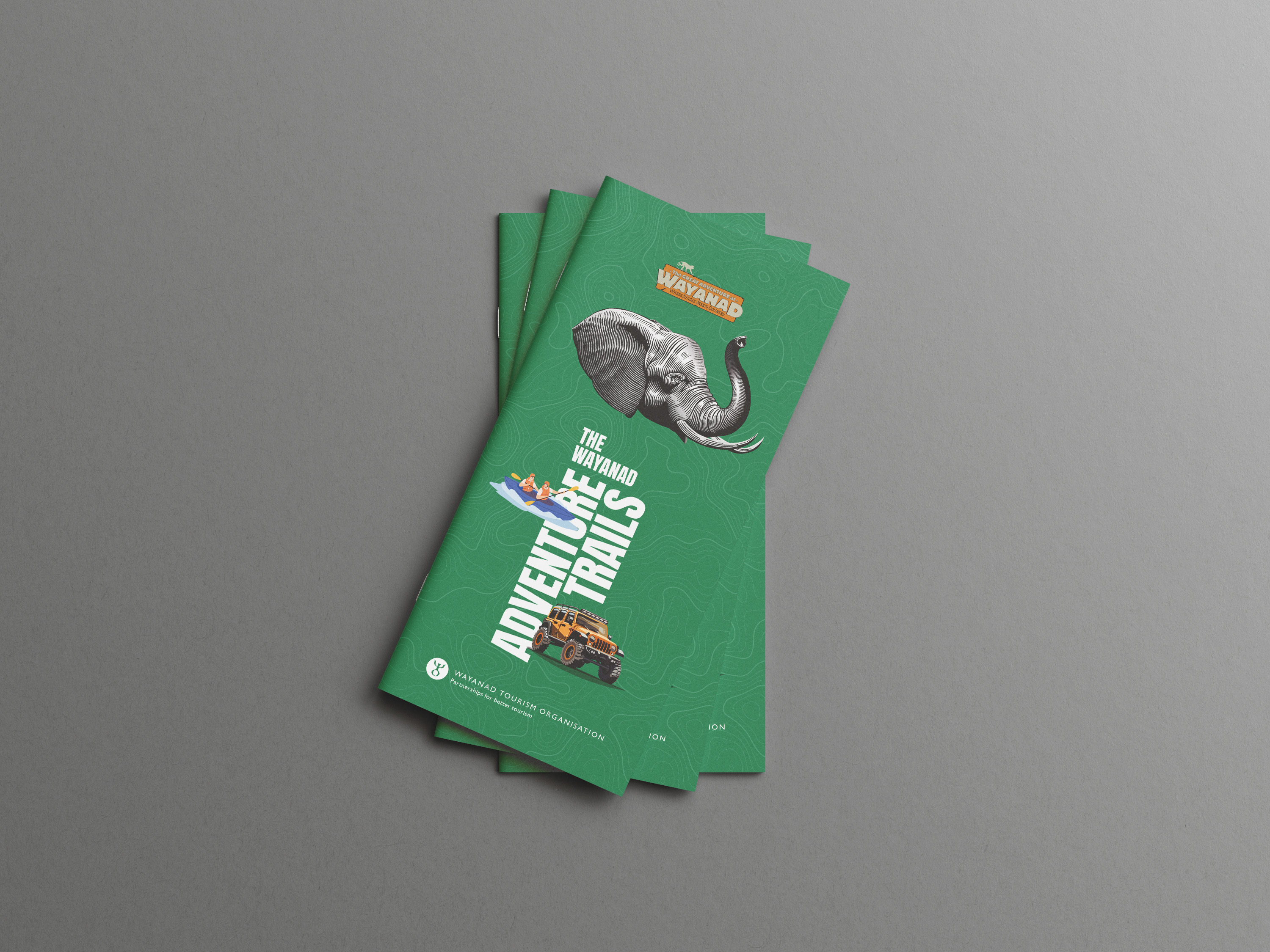 Wayanad Tourism Organisation adventure trails brochure with elephant illustration, jeep safari, and kayaking – guide to scenic landscapes, resorts, homestays, and cultural experiences in Wayanad, Kerala