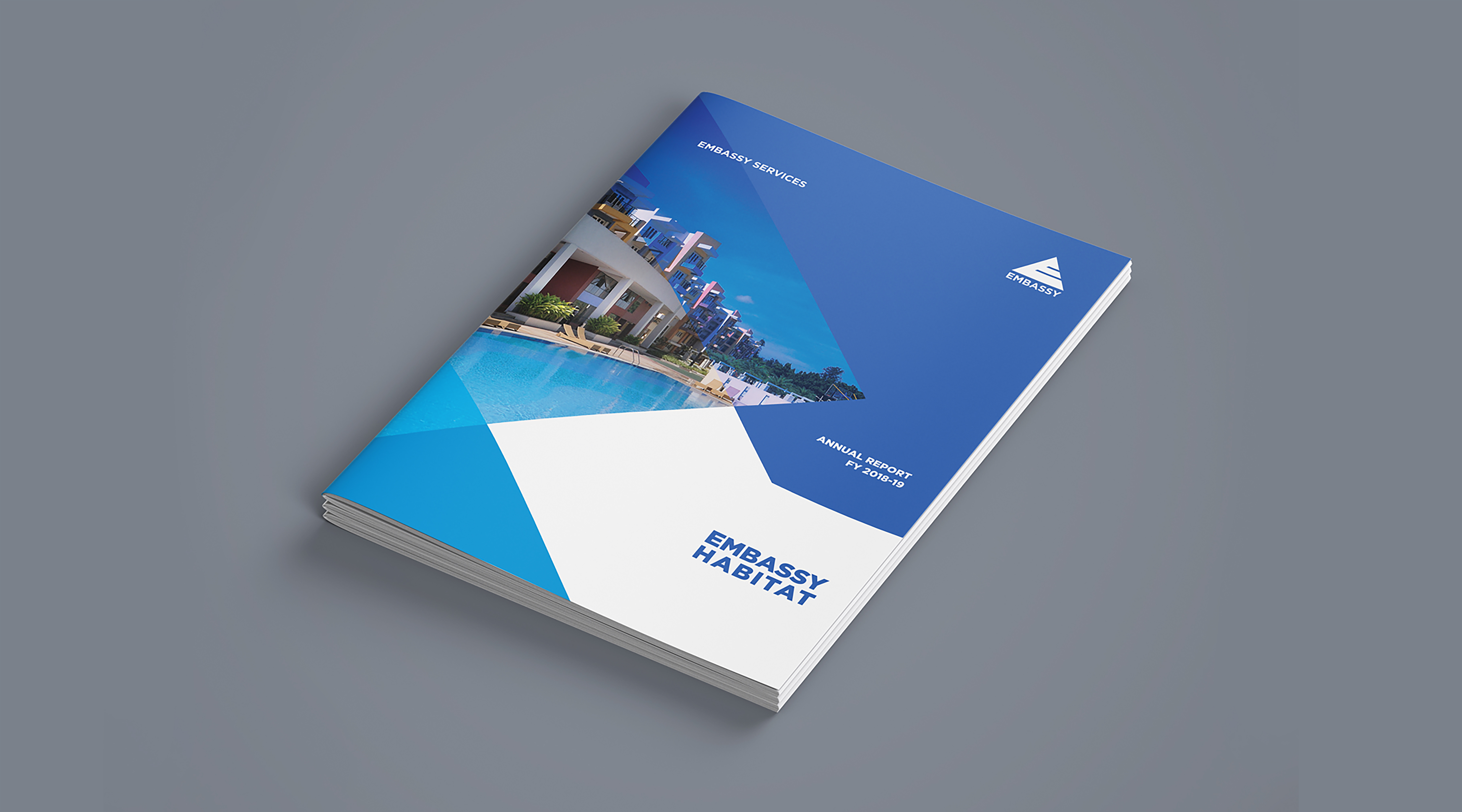 Embassy Habitat annual report FY 2018-19 by Embassy Services featuring residential complex and swimming pool on cover
