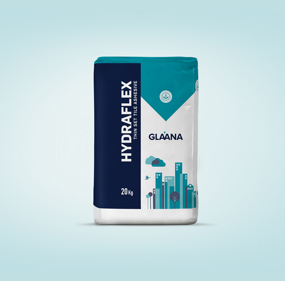 Glaana Hydraflex Thin Set Tile Adhesive 20kg bag with blue-white design and cityscape illustration highlighting eco-friendly waterproofing solution