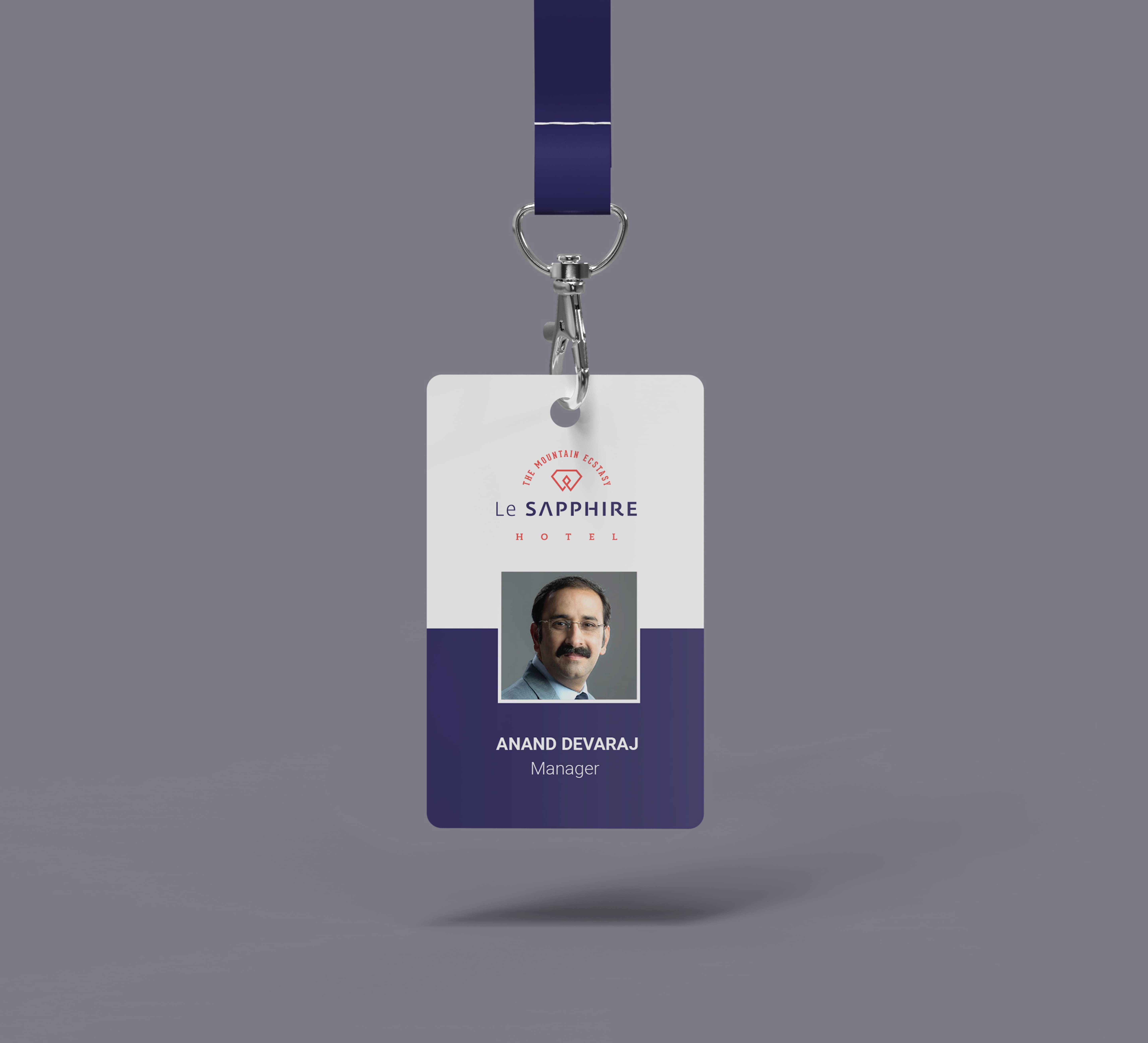 Le SAPPHIRE Hotel employee ID card for Anand Devaraj, Manager, with company logo and blue lanyard
