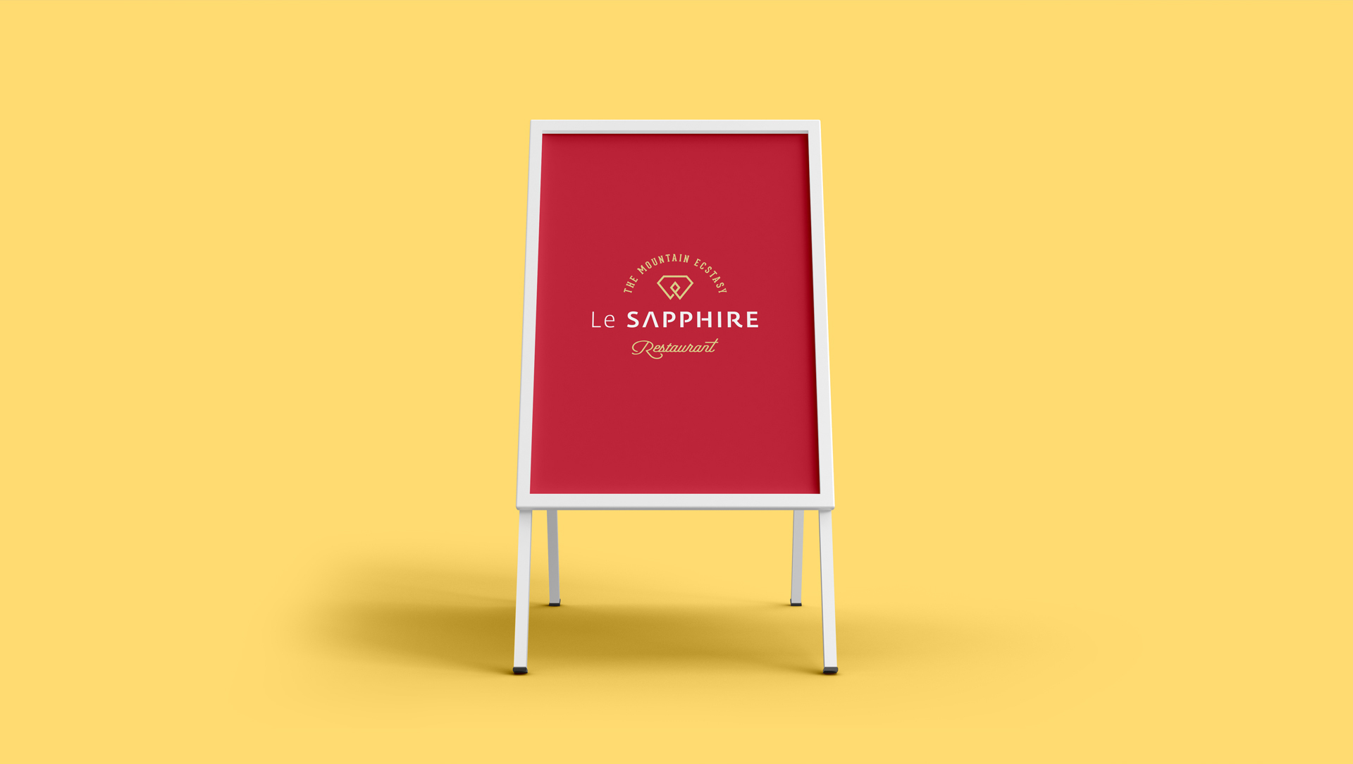 Le SAPPHIRE Restaurant A-frame sign with red board and white frame against a yellow background