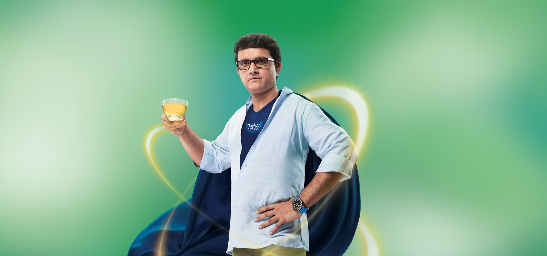 Nuetone superhero-themed image featuring a man in a blue cape holding a yellow drink on a green background, representing the brand's bold and dynamic identity on the website