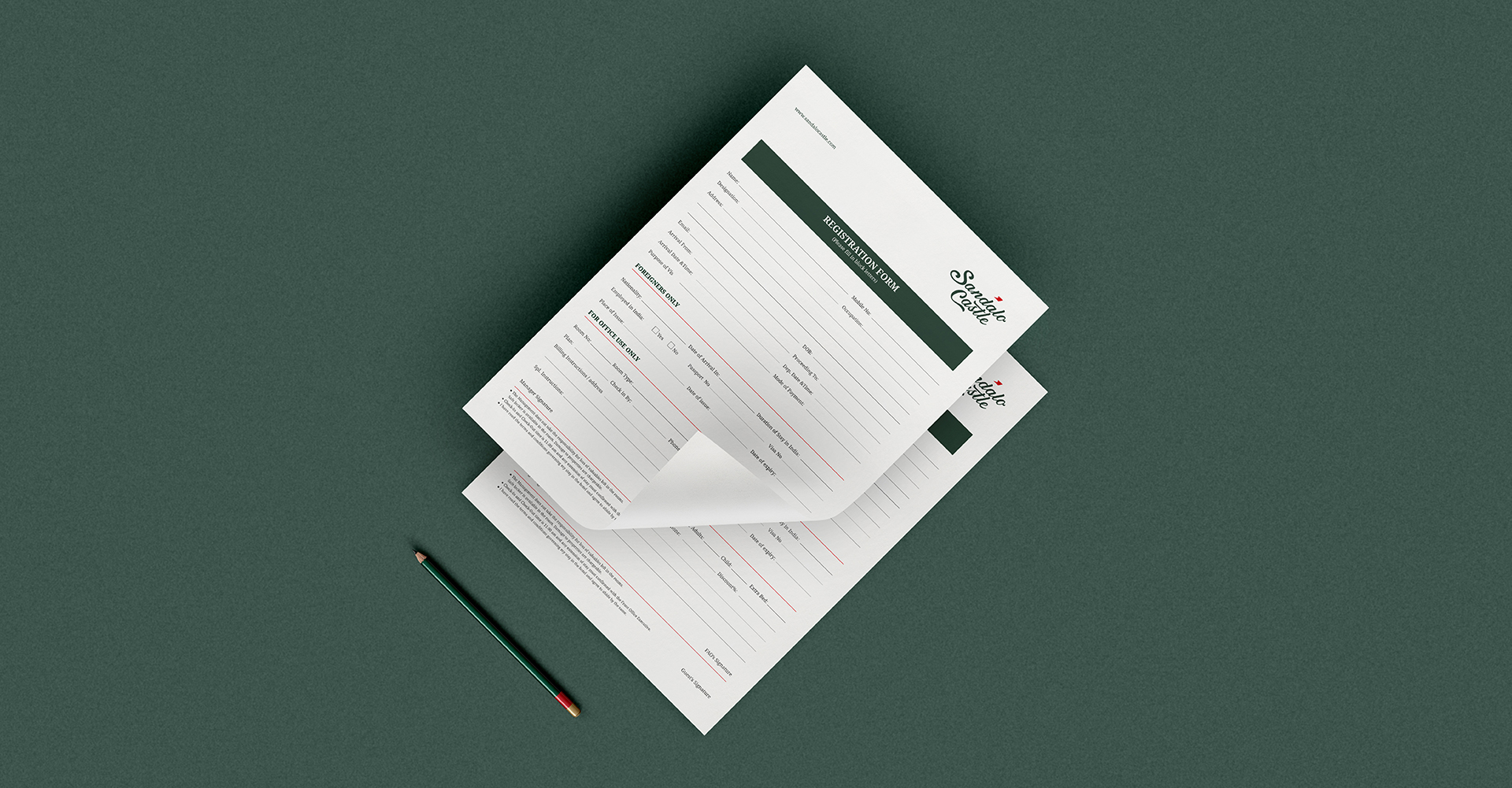 A top-down view of two Sandalo Castle registration forms, one slightly elevated, showing the branded forms with a dark green accent. A pencil is visible below the papers on a dark green background.
