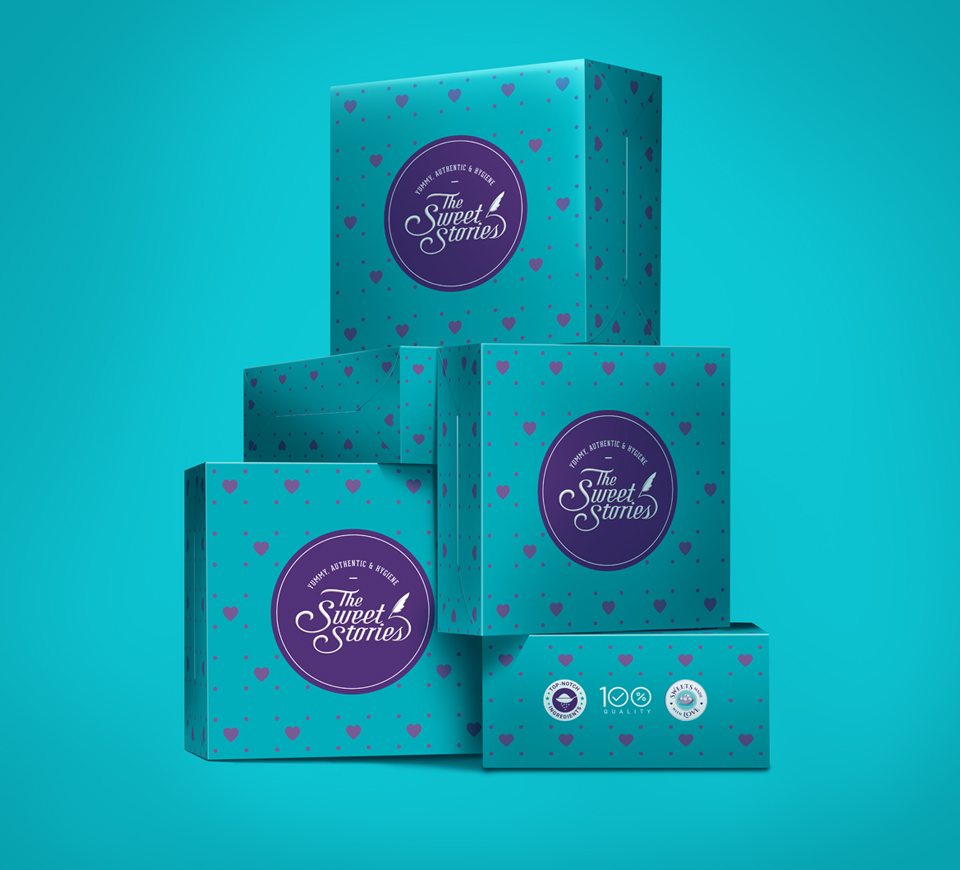 Premium turquoise packaging of The Sweet Stories sweets with heart patterns and logo – traditional, authentic, and hygienic Indian sweets brand