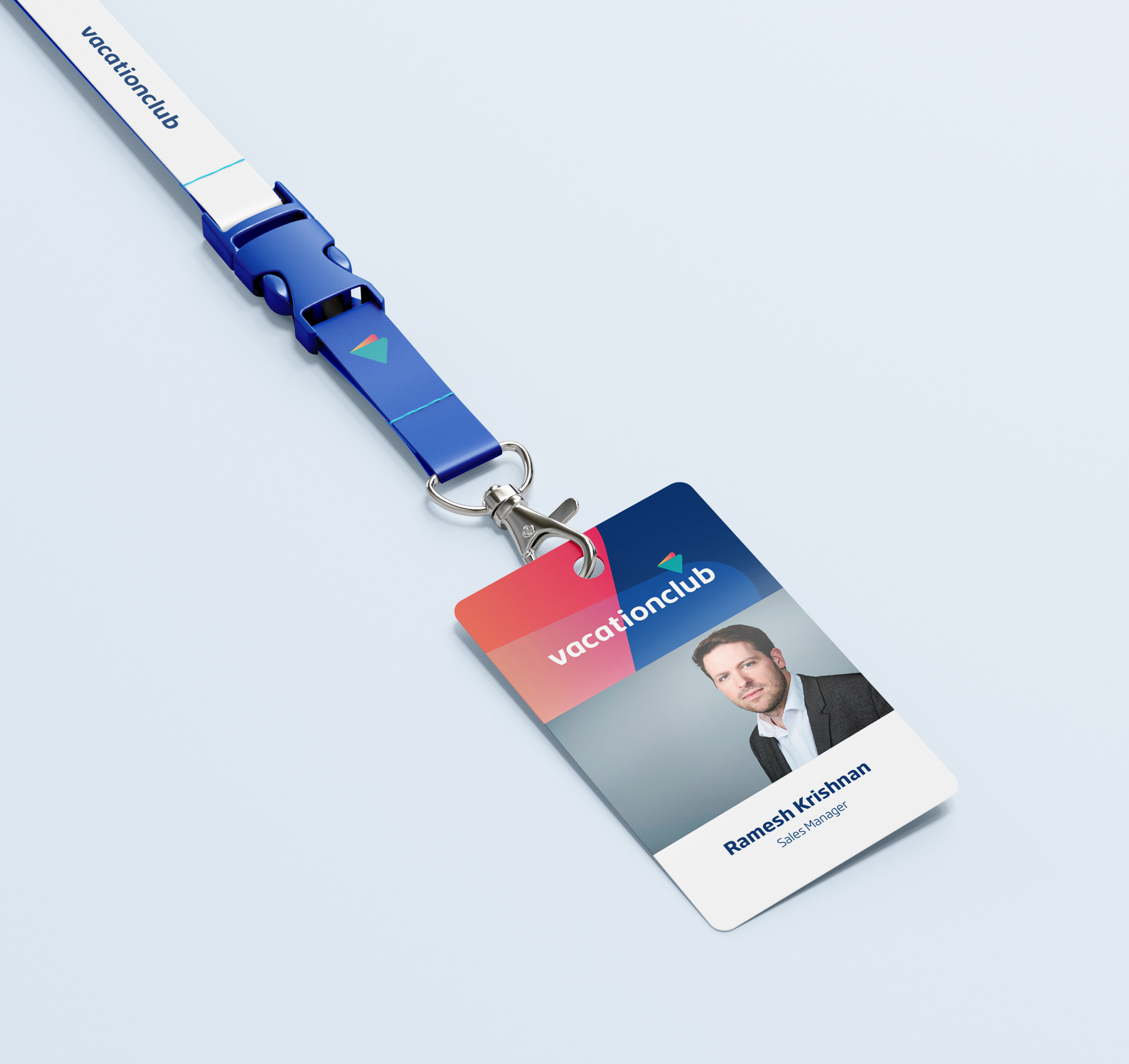 Vacationclub employee ID badge with lanyard featuring Ramesh Krishnan, Sales Manager, on a blue background.